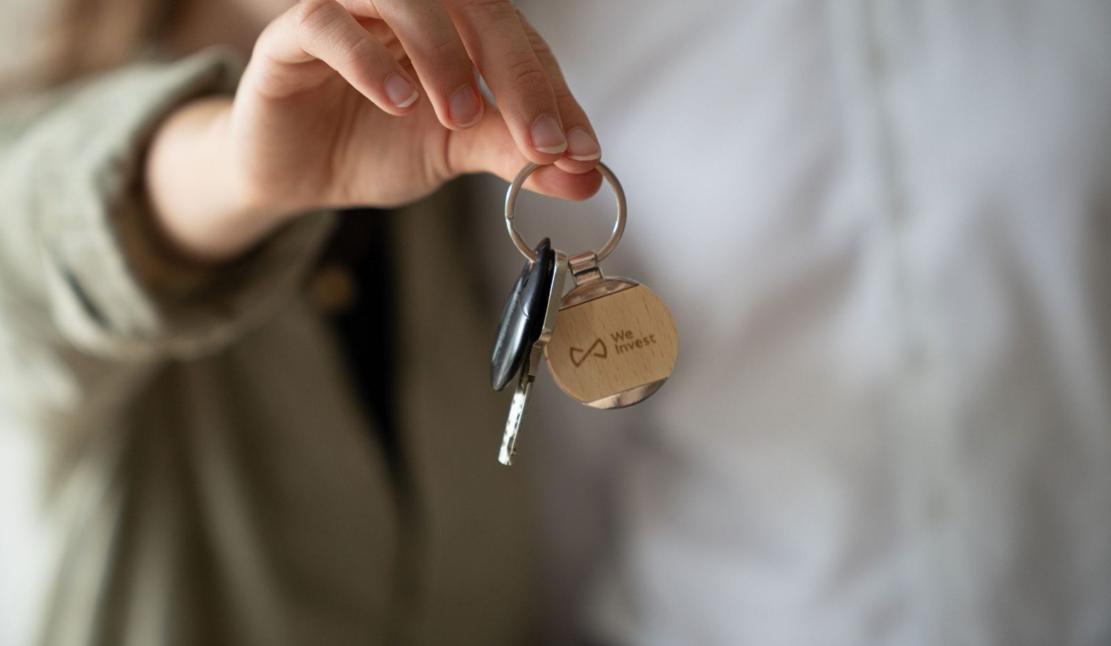 Remise d’un porte-clés We Invest lors de la remise des clés
